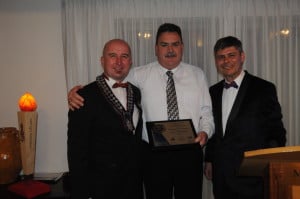 Keith Blind, President of the Fire Protection Association of New Zealand and Michael James, President of the Society of Fire Protection Engineers New Zealand Chapter, presenting Trent Fearnley, President of the Institution of Fire Engineers (IFE) NZ Branch with the 100 years anniversary plaque.